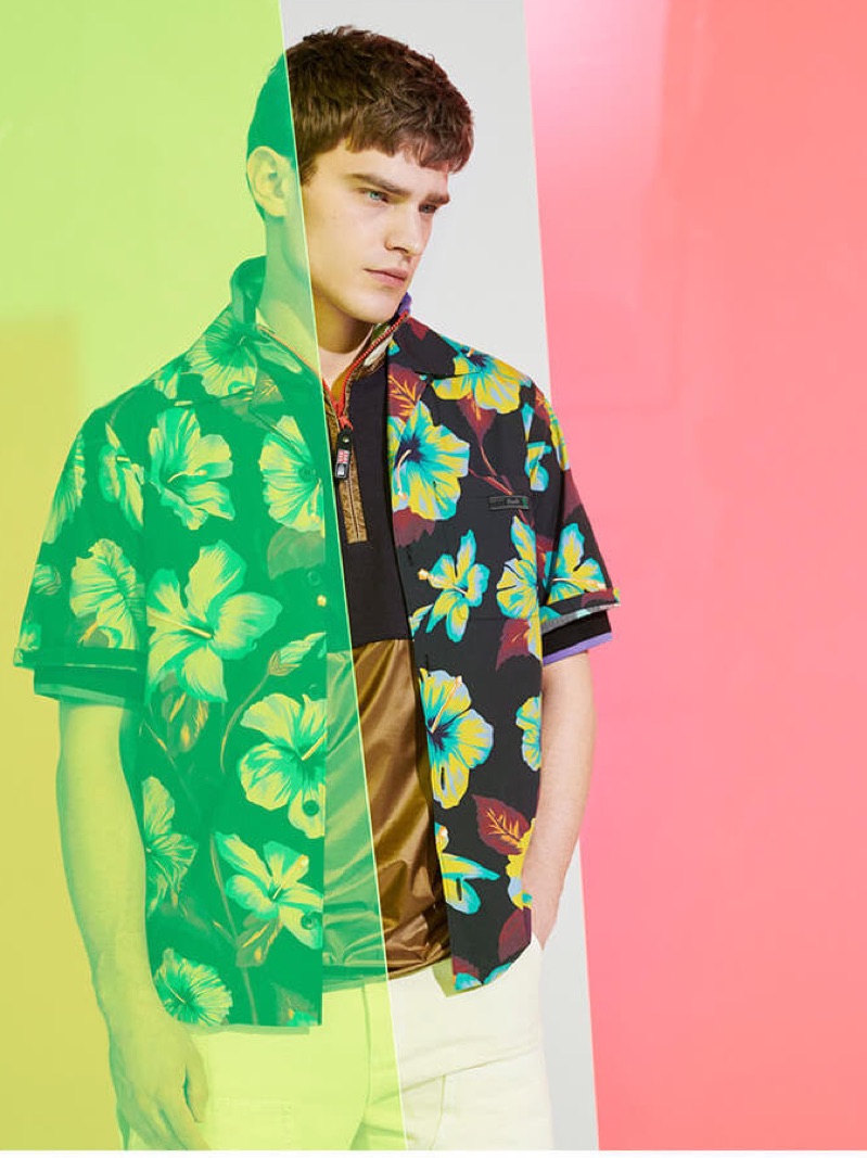 Bo Develius layers a tropical print shirt with a sporty Lanvin t-shirt.