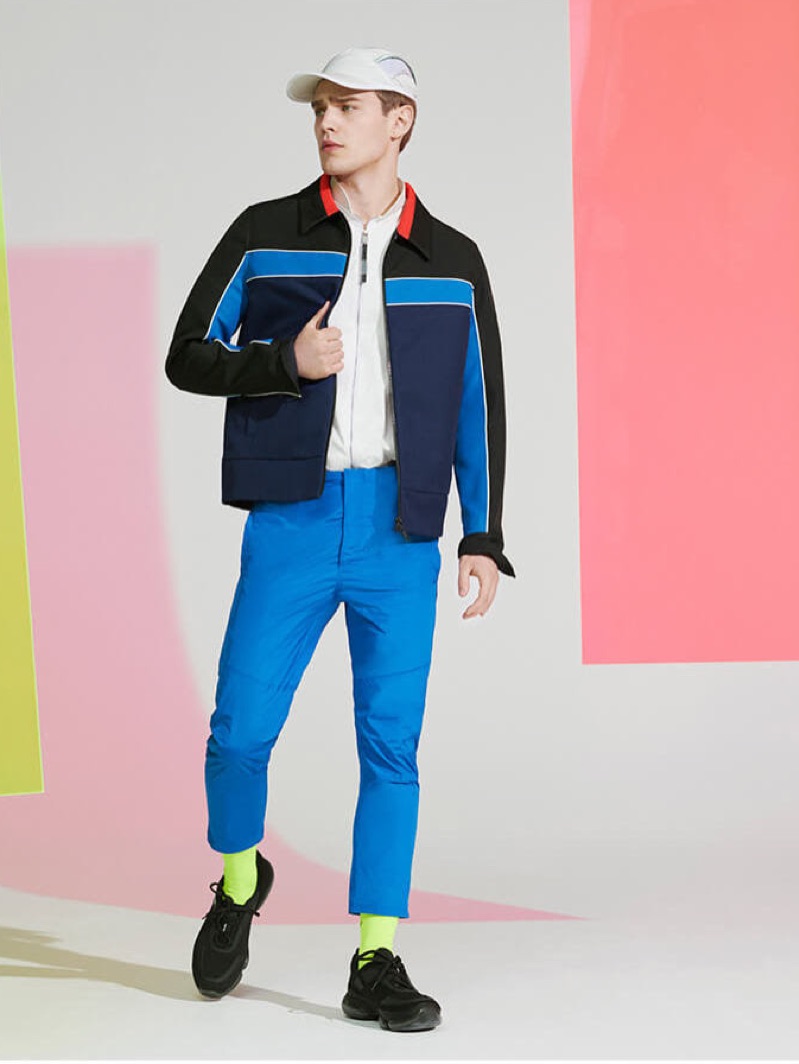 Embracing ultra-saturated colors, Bo Develius steps into a pair of Jil Sander pants.