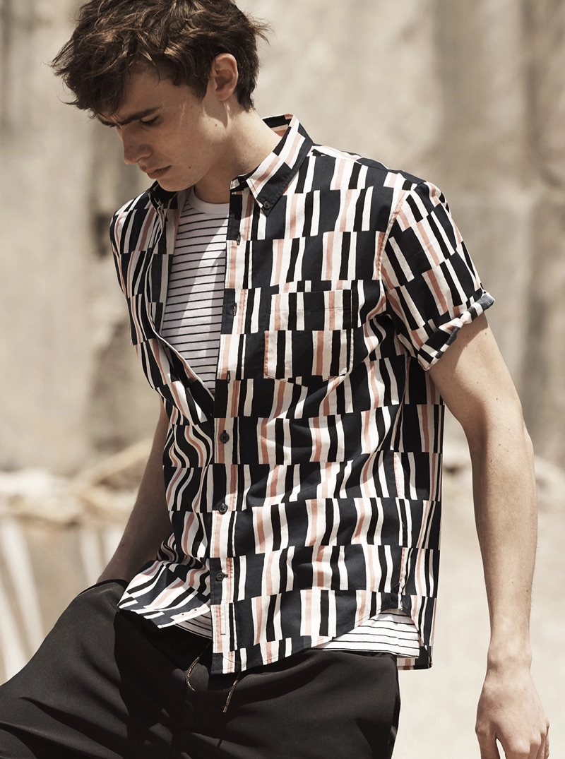 Mixing prints, Liam Little sports a striped tee with a Club Monaco graphic shirt $79.50.