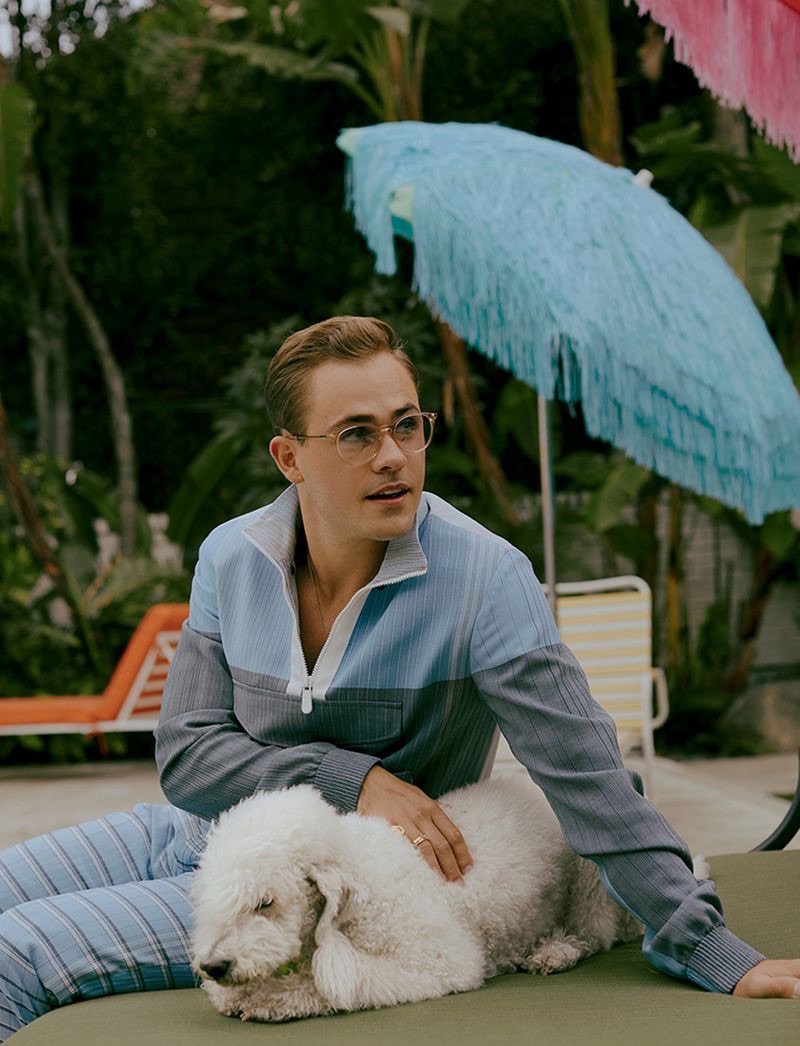 Relaxing outside, Dacre Montgomery rocks a look from Ermenegildo Zegna.