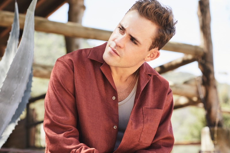 Actor Dacre Montgomery sports a Camoshita camp-collar shirt, Billy tank, and a Saint Laurent necklace.