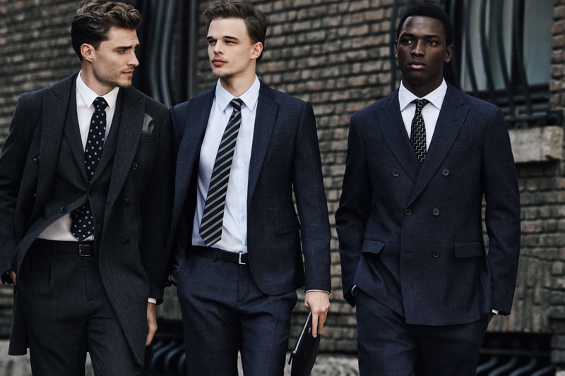 Donning tailored suits, Clad in white, Ivan Kozak, André Bona, and Daniel Morel appear in Emporio Armani's fall-winter 2019 men's campaign.