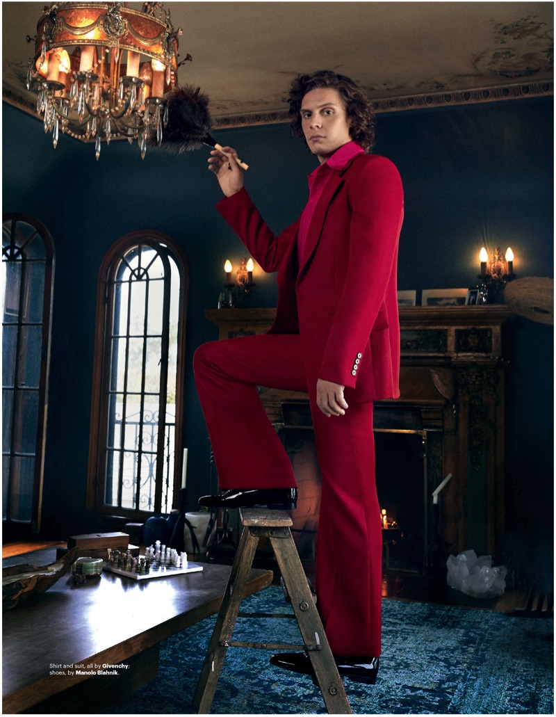 Standing out in red, Evan Peters dons a suit by Givenchy.