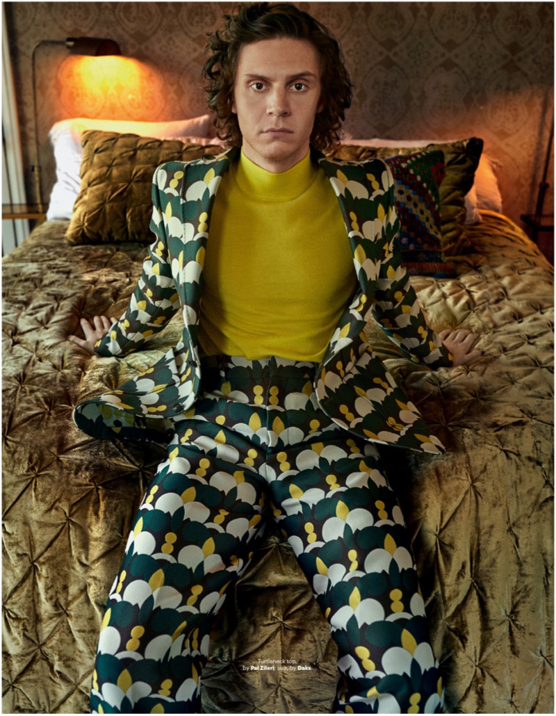 Embracing a quirky print, Evan Peters sports a Daks suit with a Pal Zileri turtleneck.