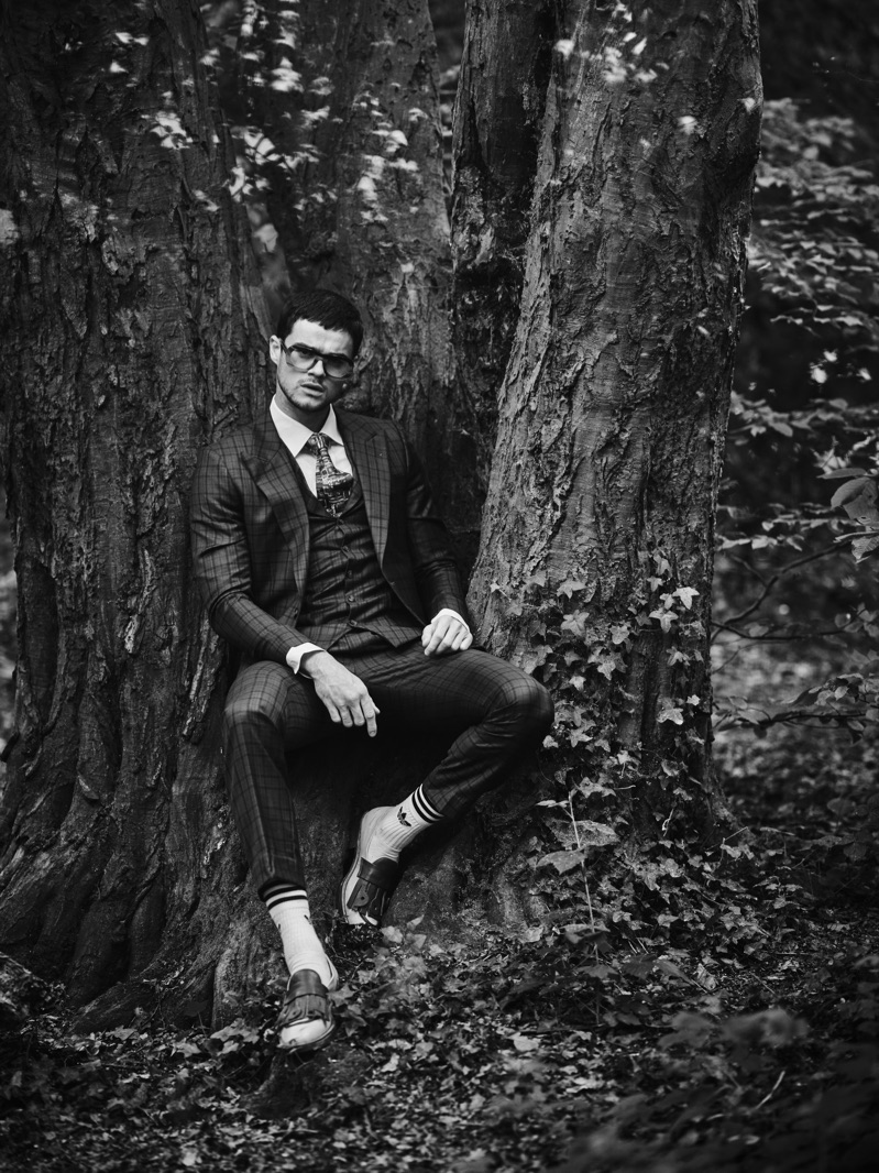 Embracing a dapper edge, Christian Williams wears all clothes Helen Anthony and glasses Delirious Eyewear.