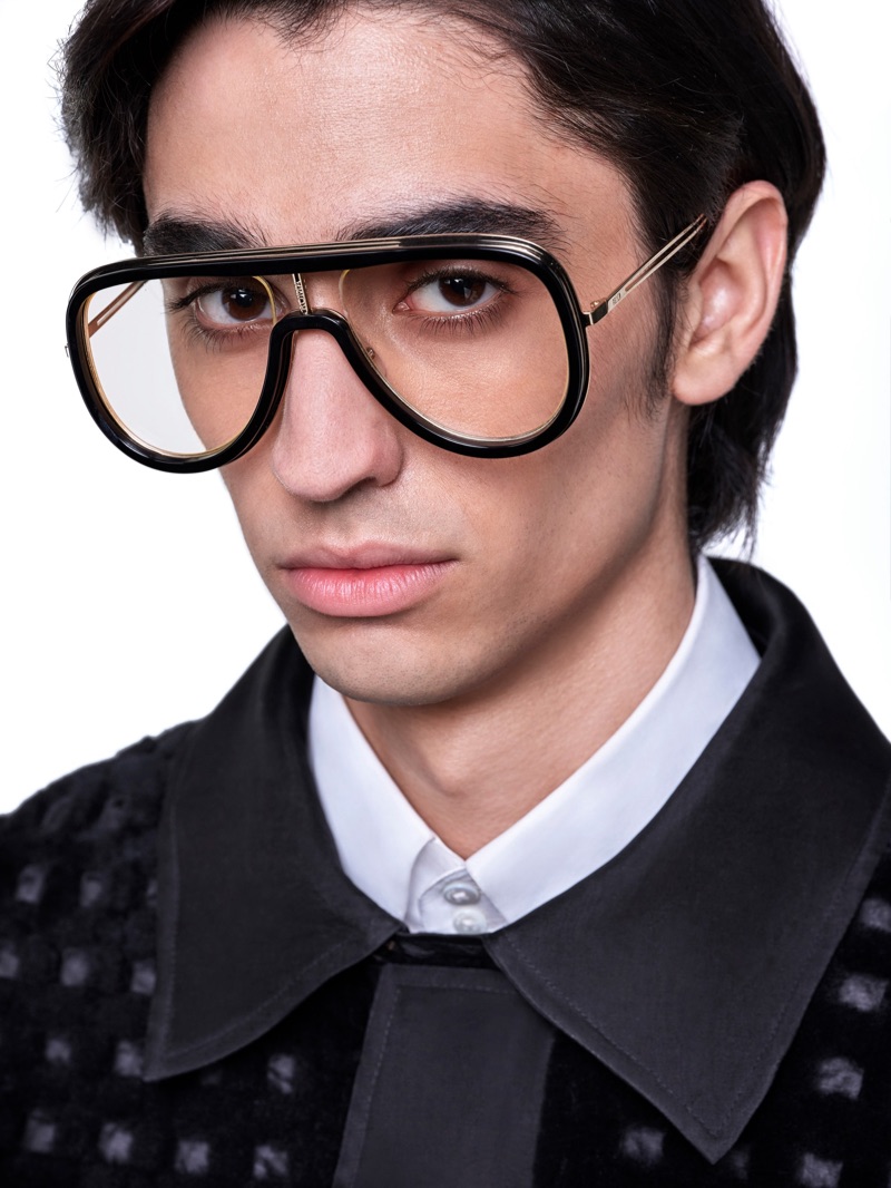 Aramish Mangi sports Futuristic Fendi gold and black sunglasses. 