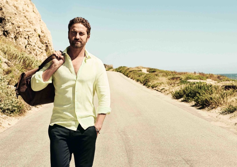 Embracing a pop of color, Gerard Butler wears a yellow shirt by OLYMP.