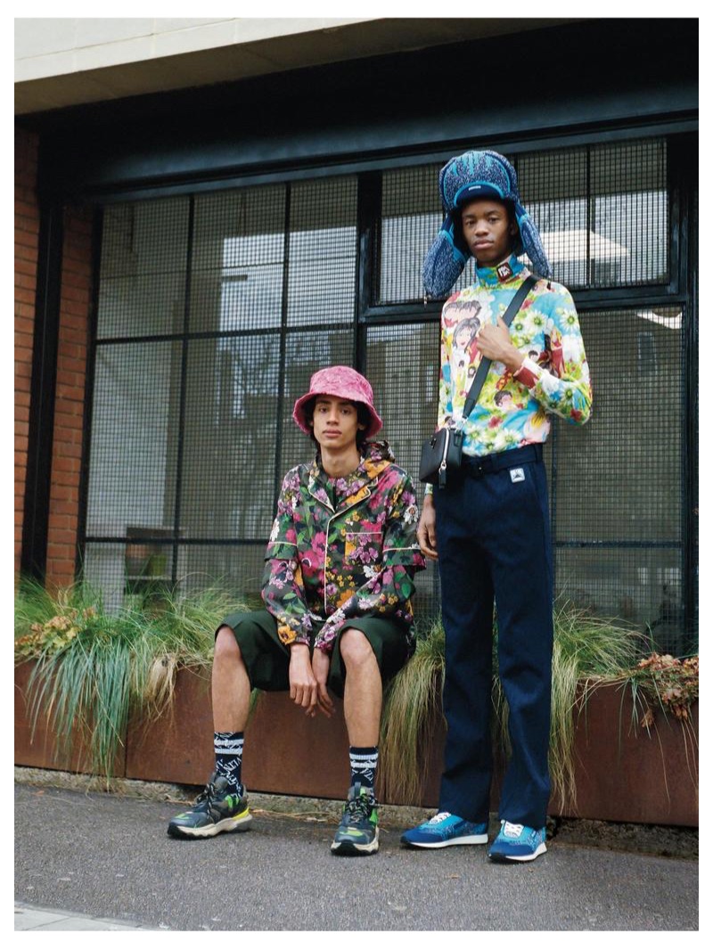 From left, Benjamin wears VALENTINO jacket £850, shirt £490, shorts £490, hat £1,275, socks £90 and trainers £660; Montell wears PRADA top £510, trousers £1,390, hat £535, bag £1,160 and trainers £550