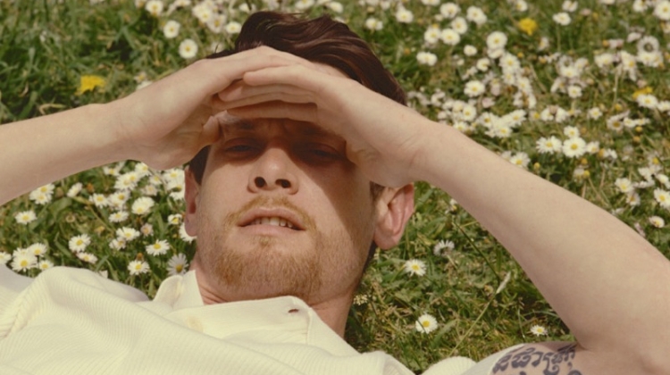 Jack O'Connell dons a textured Sandro polo shirt.