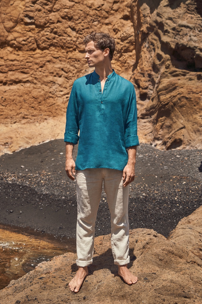 Exploring his surroundings, Tom Warren dons a green Luca Faloni linen shirt.