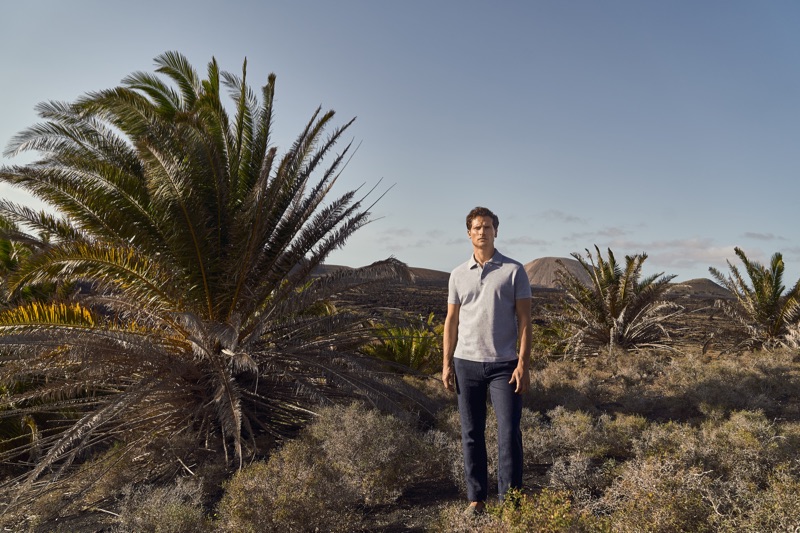 Venturing outdoors, Tom Warren sports a light grey polo by Luca Faloni.