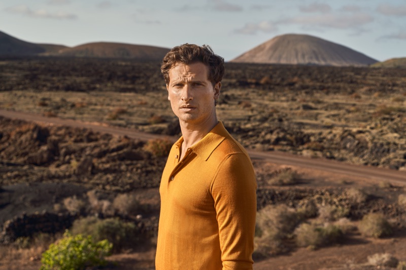 A vision in mustard yellow, Tom Warren wears a silk-cashmere polo for Luca Faloni's summer 2019 campaign.