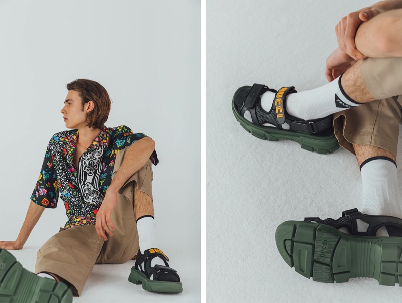 Taking to the studio, Michele Lanotte sports a Versace floral print silk bowling shirt $1,550, Jacquemus cargo pants $254, Valentino logo socks $125, and Gucci sandals $890.