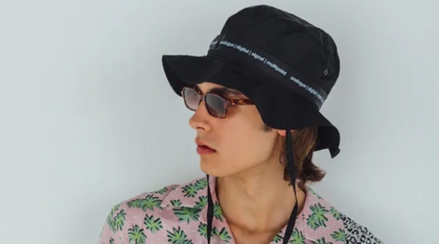 Undercover Looks: Michele Lanotte Sports Quirky Styles for Luisaviaroma A summer vision, Michele Lanotte models a TDT Tourne De Transmission bucket hat $166, AMIRI palm and leopard print shirt $595, Maison Margiela pleated trousers $696, and Flatlist Eyewear sunglasses $255.