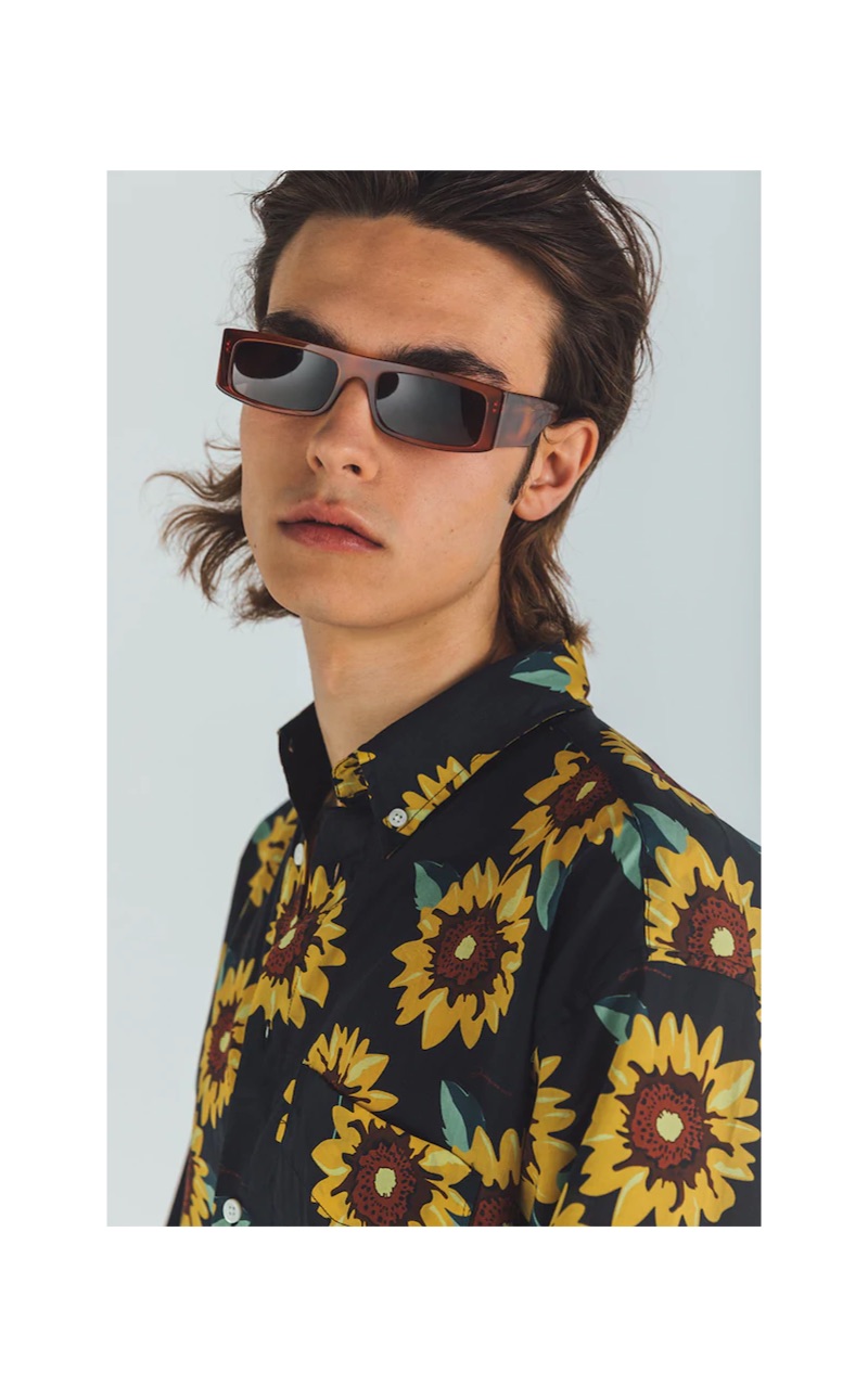 Rocking a Jacquemus sunflower print shirt $217, Michele Lanotte also wears Andy Wolf sunglasses $319.