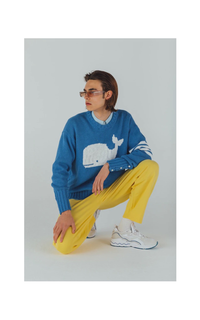 Michele Lanotte dons a Thom Browne sweater with Andy Wolf sunglasses $319, Jacquemus pants $193, and Mizuno sneakers $138.