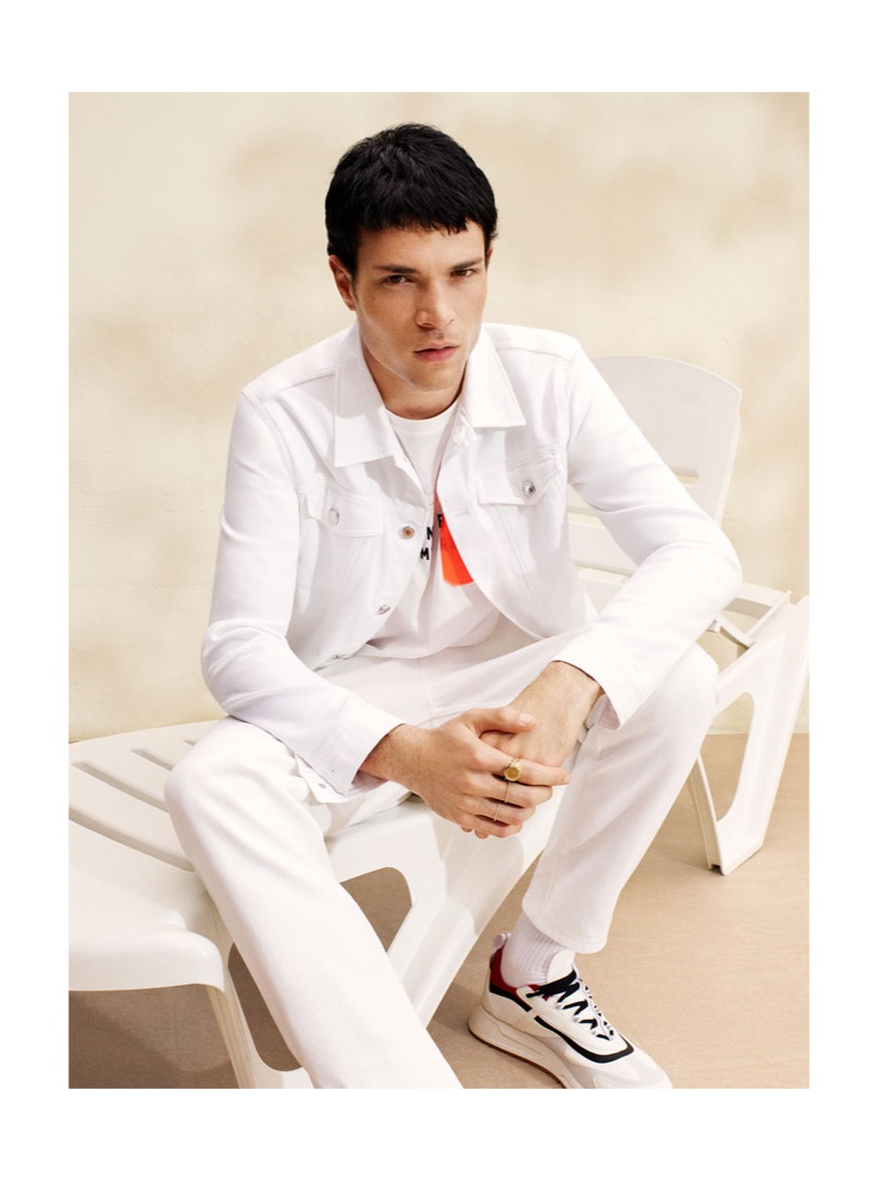 Luka Isaac wears a white denim look from Zara Man.