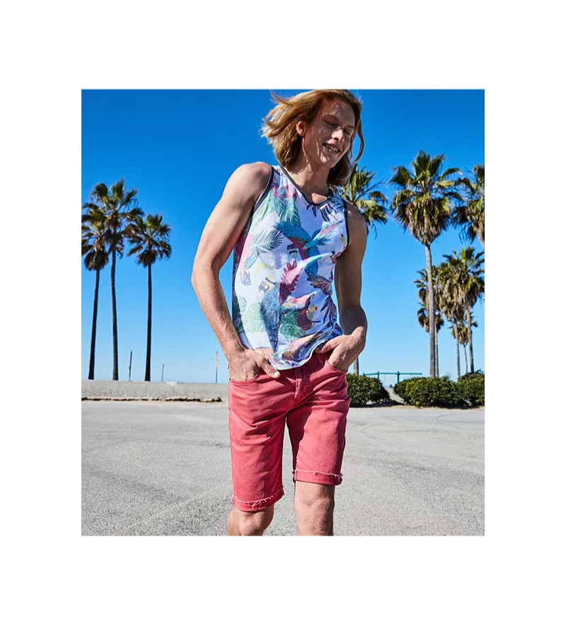 Channeling Cali style, Hunter Bach wears a Levi's bird print tank $34.50 and slim cut-off jeans $50 with Converse Chuck Taylor All Star sneakers $50.