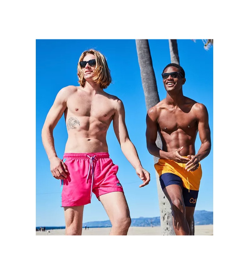 Left: Hunter Bach sports Superdry beach volley swim shorts $34.50. Right: Hamid Onifade wears Calvin Klein logo 7" swim trunks $58.