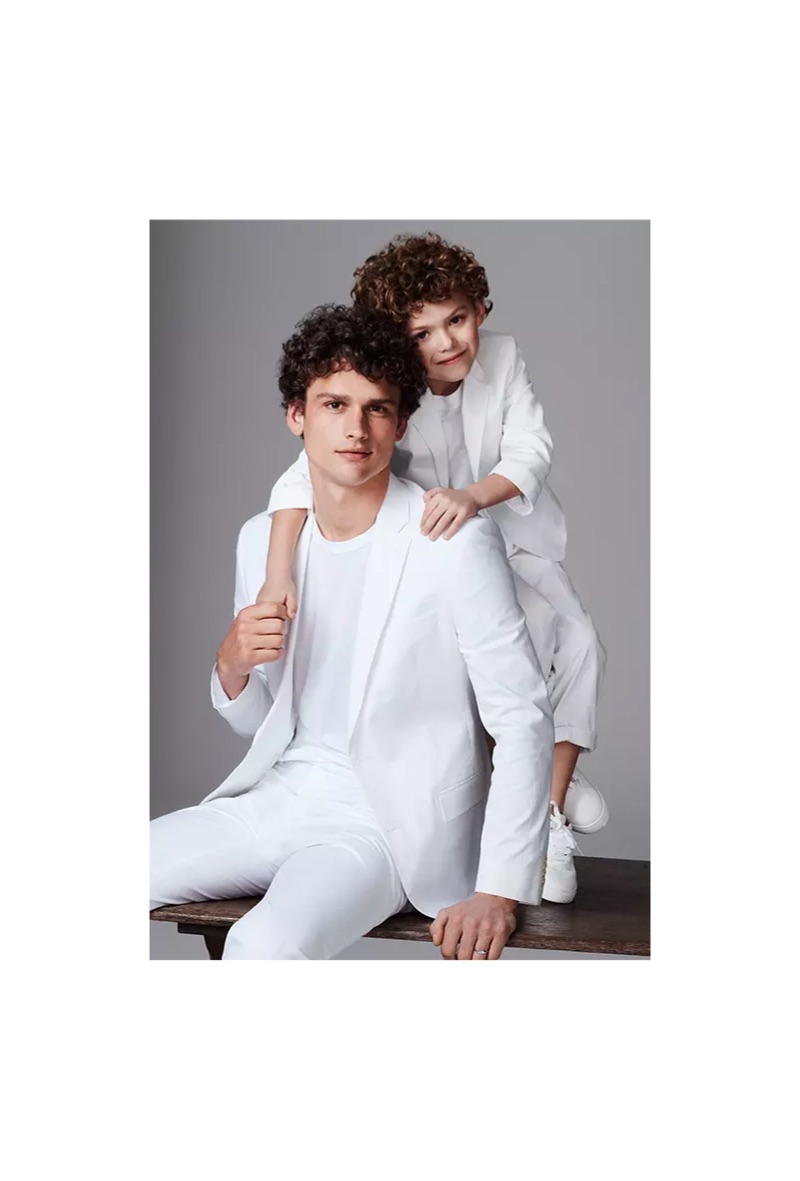 A vision in white, Simon Nessman dons an I.N.C. linen-blend blazer and dress pants.