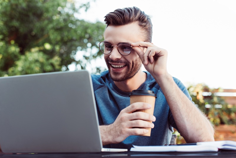 Man Laptop Glasses Coffee Cup Smiling