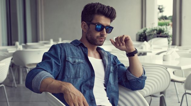 3 Reasons to Choose Designer Sunglasses Over an Off-Brand Pair Man Wearing Denim Shirt Jeans and Blue Sunglasses
