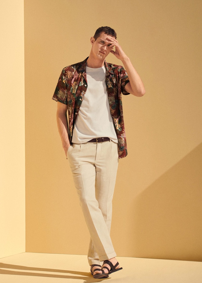 Showcasing summer style, Rutger Schoone rocks a tropical print shirt with linen trousers by Mango.