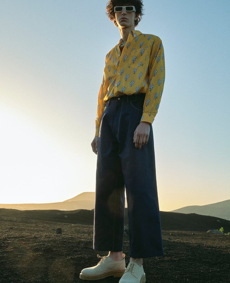 Front and center, Gena Malinin wears a Jacquemus shirt, Craig Green sweater, Marni jeans, AMI shoes, and Andy Wolf sunglasses.