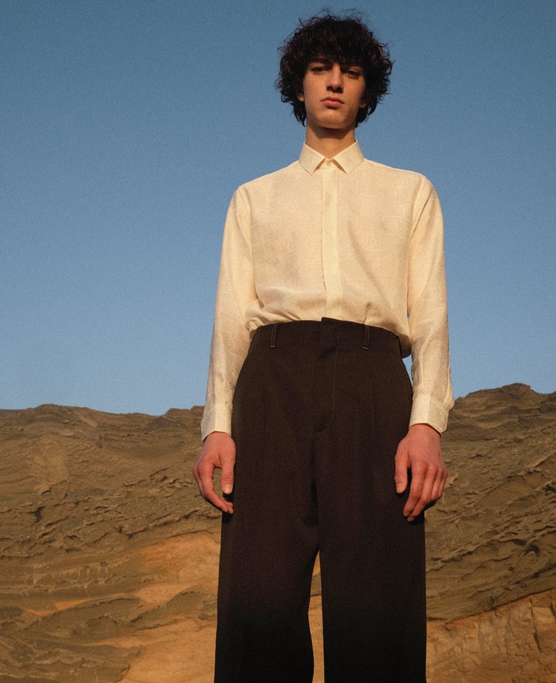 A sleek vision, Gena Malinin models a Saint Laurent shirt with Gucci trousers. 