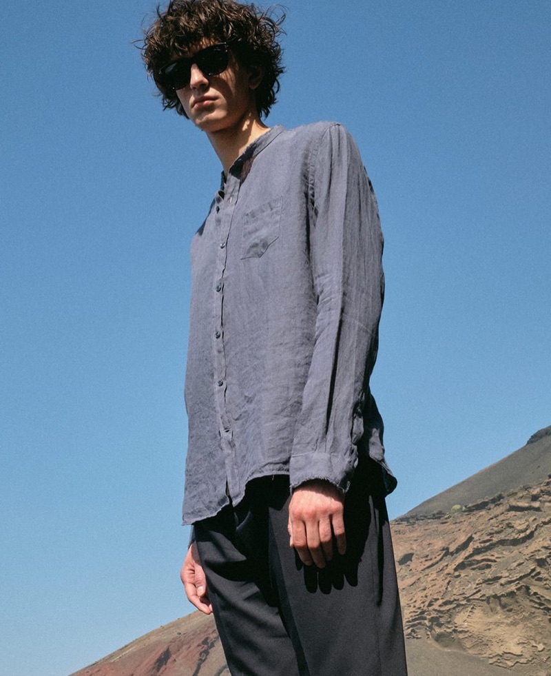 Venturing outdoors, Gena Malinin dons Jacques Marie Mage sunglasses with a Once Milano band-collar shirt and Officine Generale trousers.