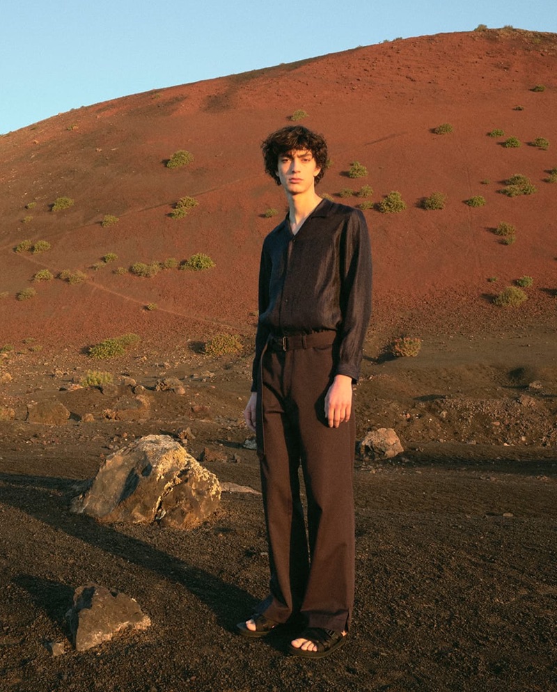 Embracing dark hues, Gena Malinin wears a Sasquatchfabrix shirt, Deveaux trousers, and Prada slides.