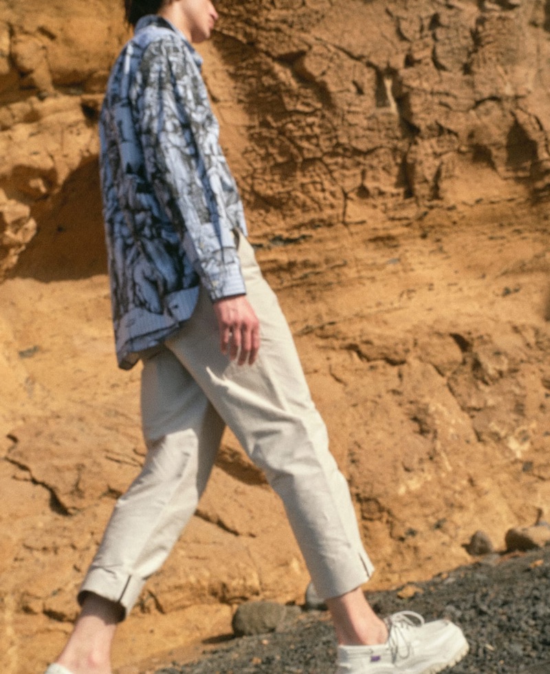 Model Gena Malinin sports a J.W. Anderson shirt, Deveaux trousers, and Eytys shoes.
