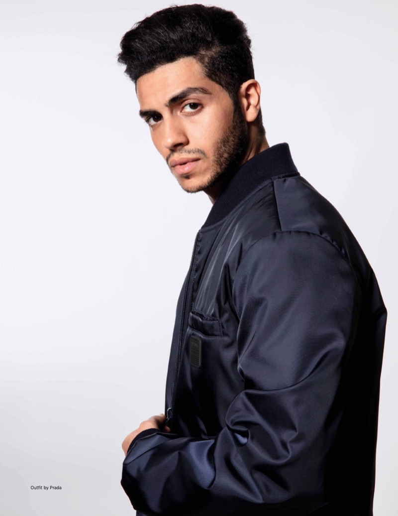 Sporting a bomber jacket by Prada, Mena Massoud stars in a new photo shoot.