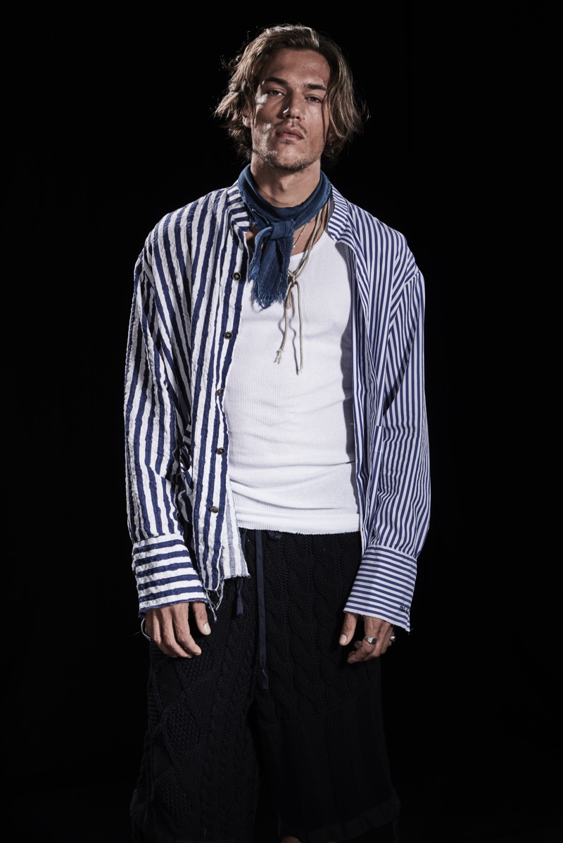Robin Decaux dons a striped shirt and cable-knit pants from Paul & Shark by Greg Lauren.