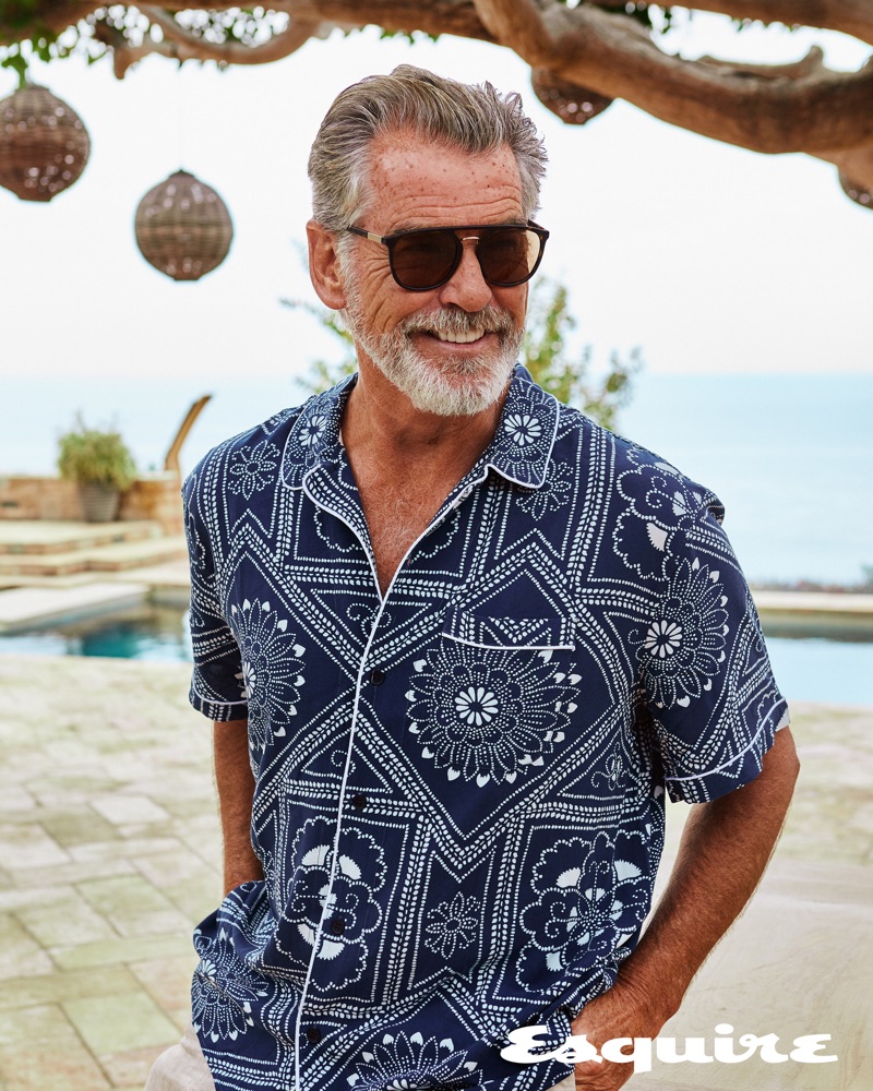 All smiles, Pierce Brosnan wears a Levi's Made & Crafted shirt with ISAIA trousers and Giorgio Armani sunglasses.