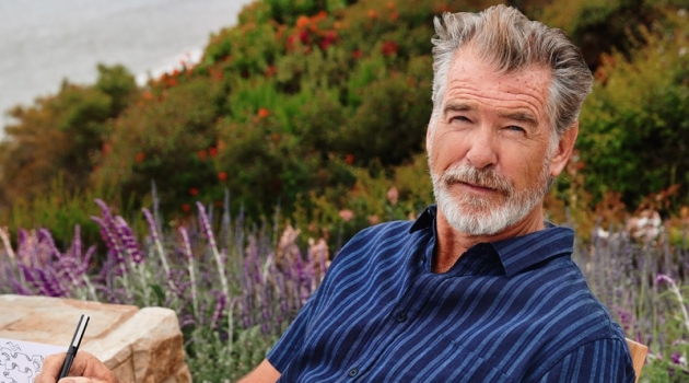 Pierce Brosnan Connects with Esquire, Discusses Painting Pierce Brosnan dons a Vince striped shirt with Giorgio Armani trousers.