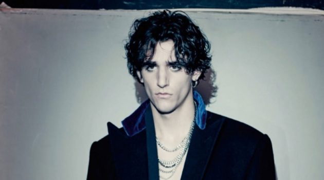Tamino Stars in Vogue Hommes Paris Shoot, Discusses Harmony Between Music & Fashion Tamino sports a wool coat by Ralph Lauren Purple Label with a velvet robe from Triple RRR.