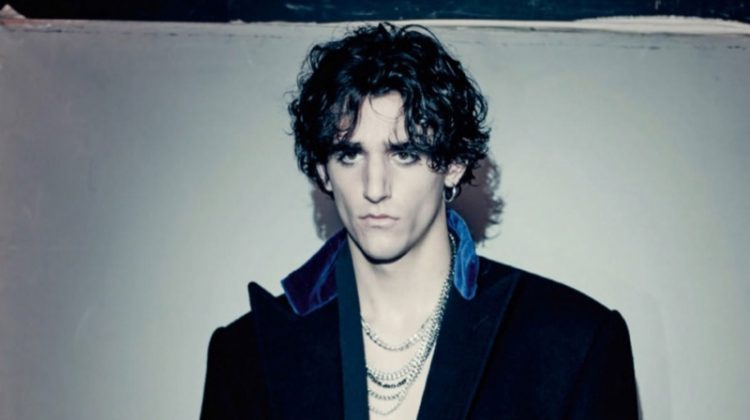 Tamino sports a wool coat by Ralph Lauren Purple Label with a velvet robe from Triple RRR.