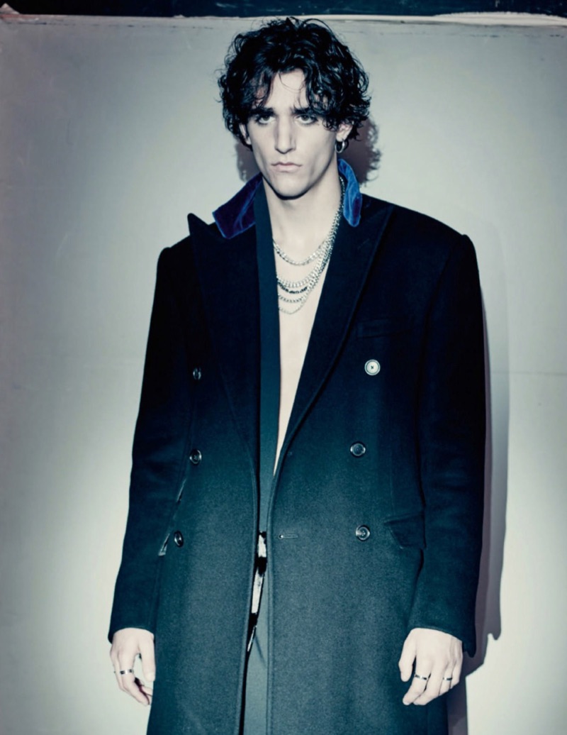 Tamino sports a wool coat by Ralph Lauren Purple Label with a velvet robe from Triple RRR.