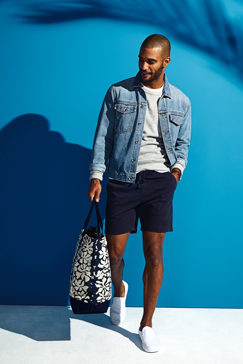 Nathan Owens takes hold of Todd Snyder x Reyn Spooner's Windjammer tote bag $158 in navy.