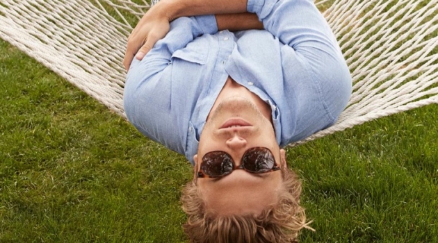 Warby Parker Escapes to Palm Springs with Christopher Mason Taking in a relaxing day in Palm Springs, Christopher Mason dons Warby Parker's Tilden acorn tortoise with gold sunglasses.