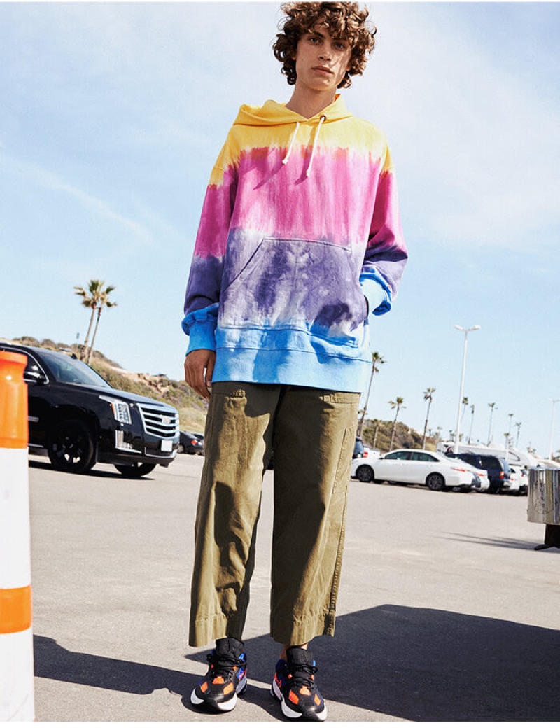 Reuniting with YOOX, Lucas Bin makes a statement in a tie-dye hoodie.