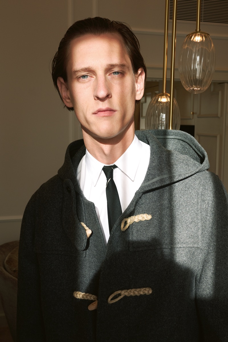 Rogier Bosschaart dons a duffle coat, shirt, and skinny tie by Celine.