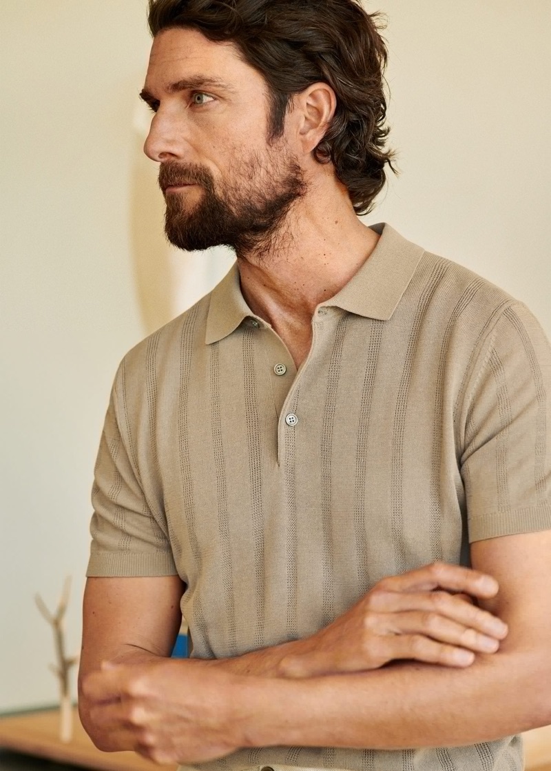 Model Cédric Bihr dons a chic knit polo from Mango Man.