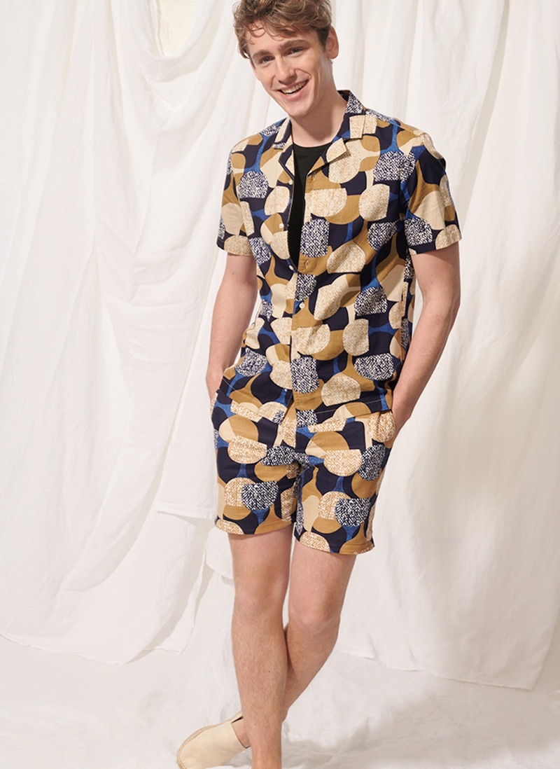 All smiles, Tom Webb wears a Club Monaco notched collar moon print shirt $89.50 and 7" shorts $89.50.