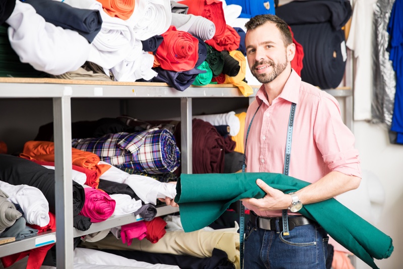 Designer Choosing Fabric Male Designer Choosing Fabric Male