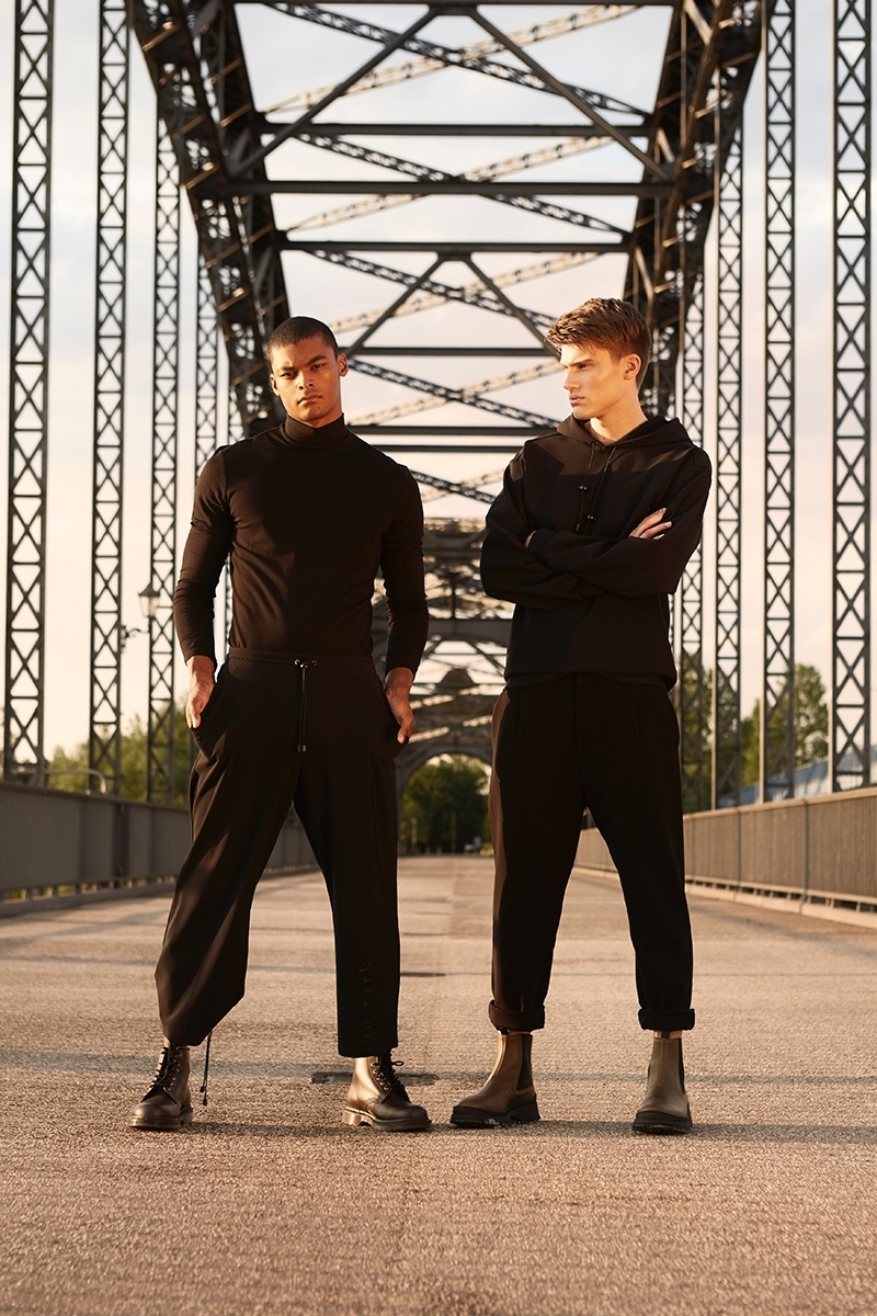 Left to Right: Eugon wears turtleneck Weekday, trousers Autarg, and boots Dr. Martens. Leon wears hoodie Autarg, trousers Weekday, and boots Arket.