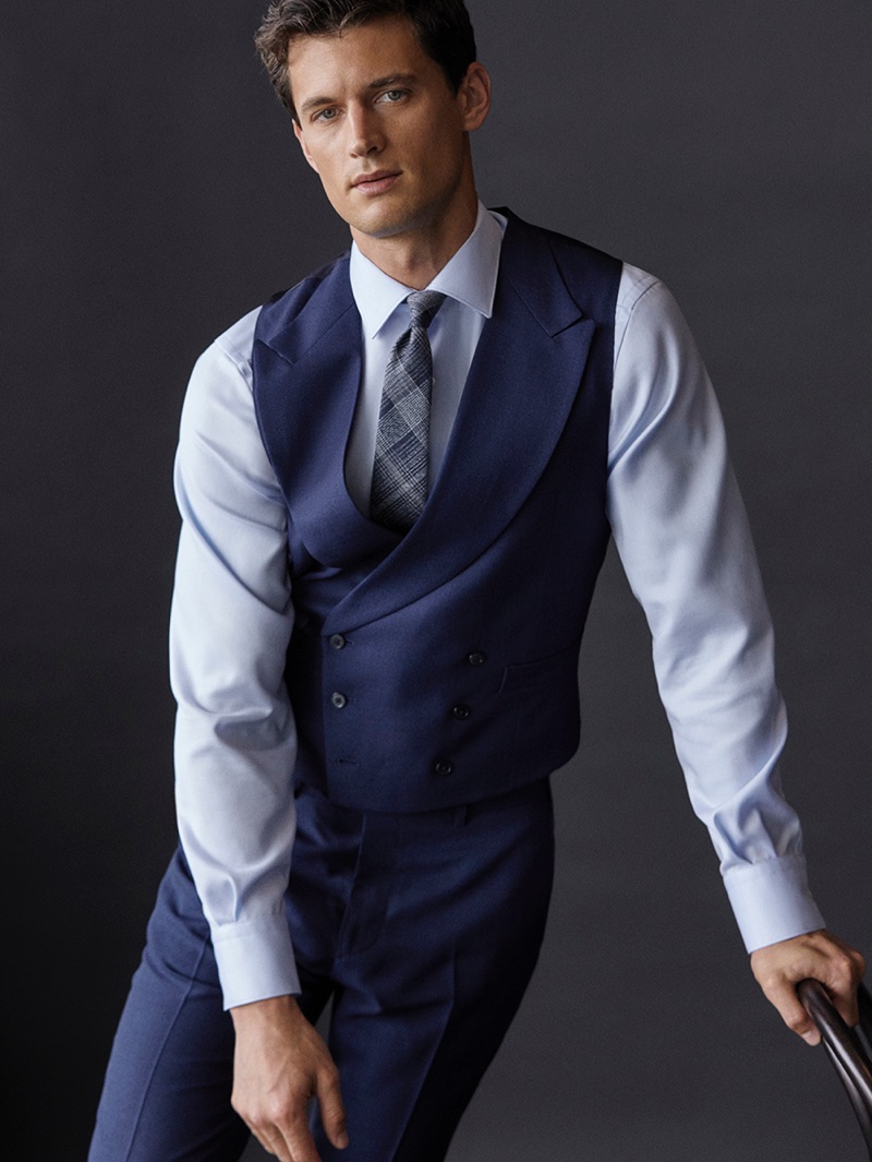 Front and center, Garrett Neff models a shirt, waistcoat, and tie by Massimo Dutti.