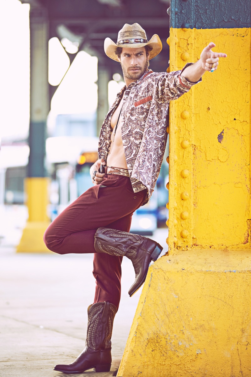 Gonçalo wears vintage shirt stylist's own, hat, boots, and belt Space Cowboy, pants Aspesi, and bolo tie Britt Bolton Jewelry. 