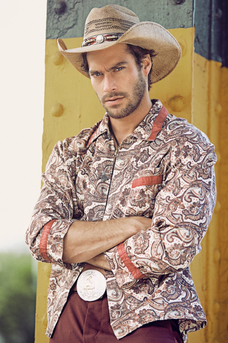 Gonçalo wears vintage shirt stylist's own, hat and belt Space Cowboy, pants Aspesi, and bolo tie Britt Bolton Jewelry. 